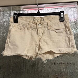 Levi’s Cream Denim Cutoff Shorts